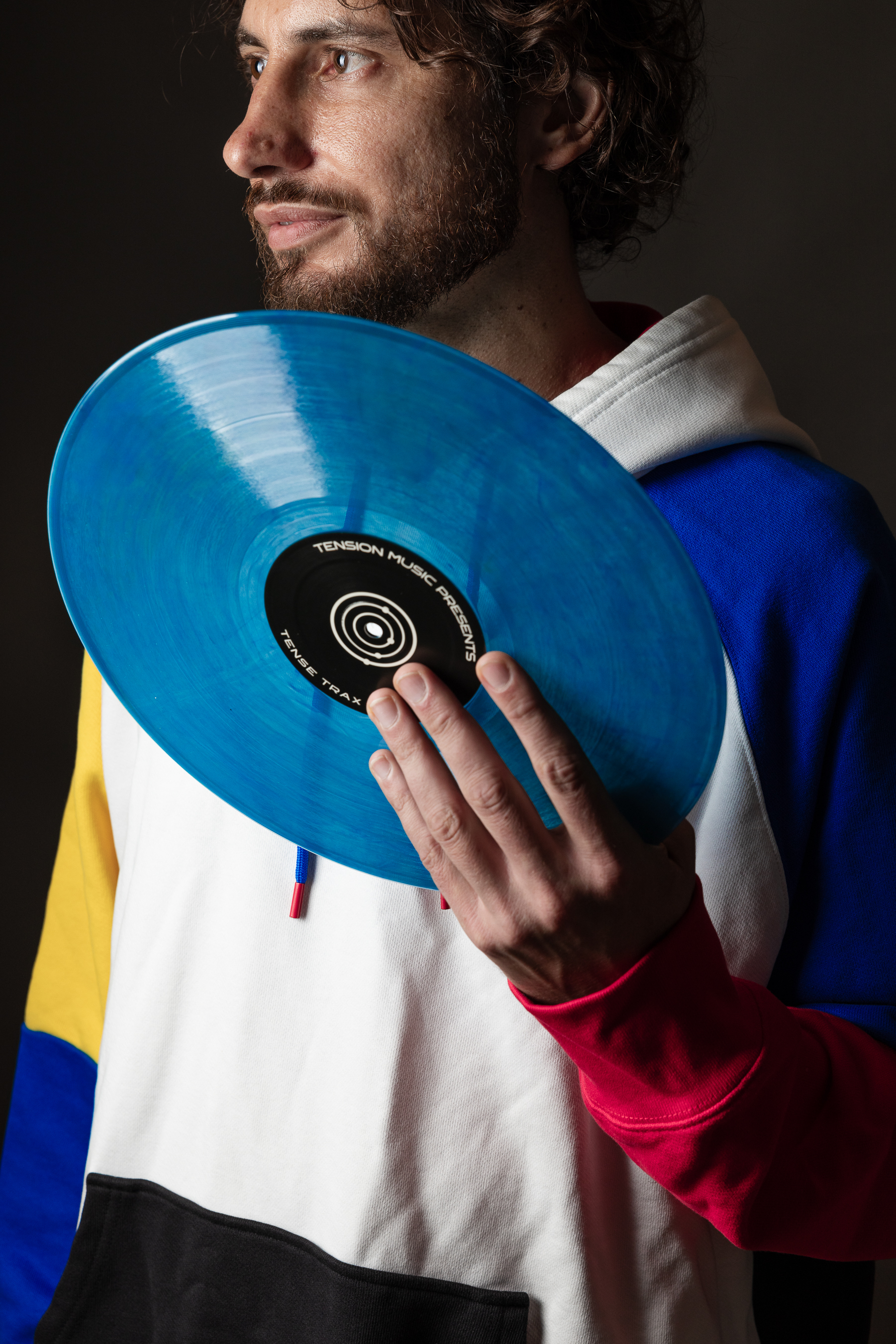 Cabra holding blue vinyl