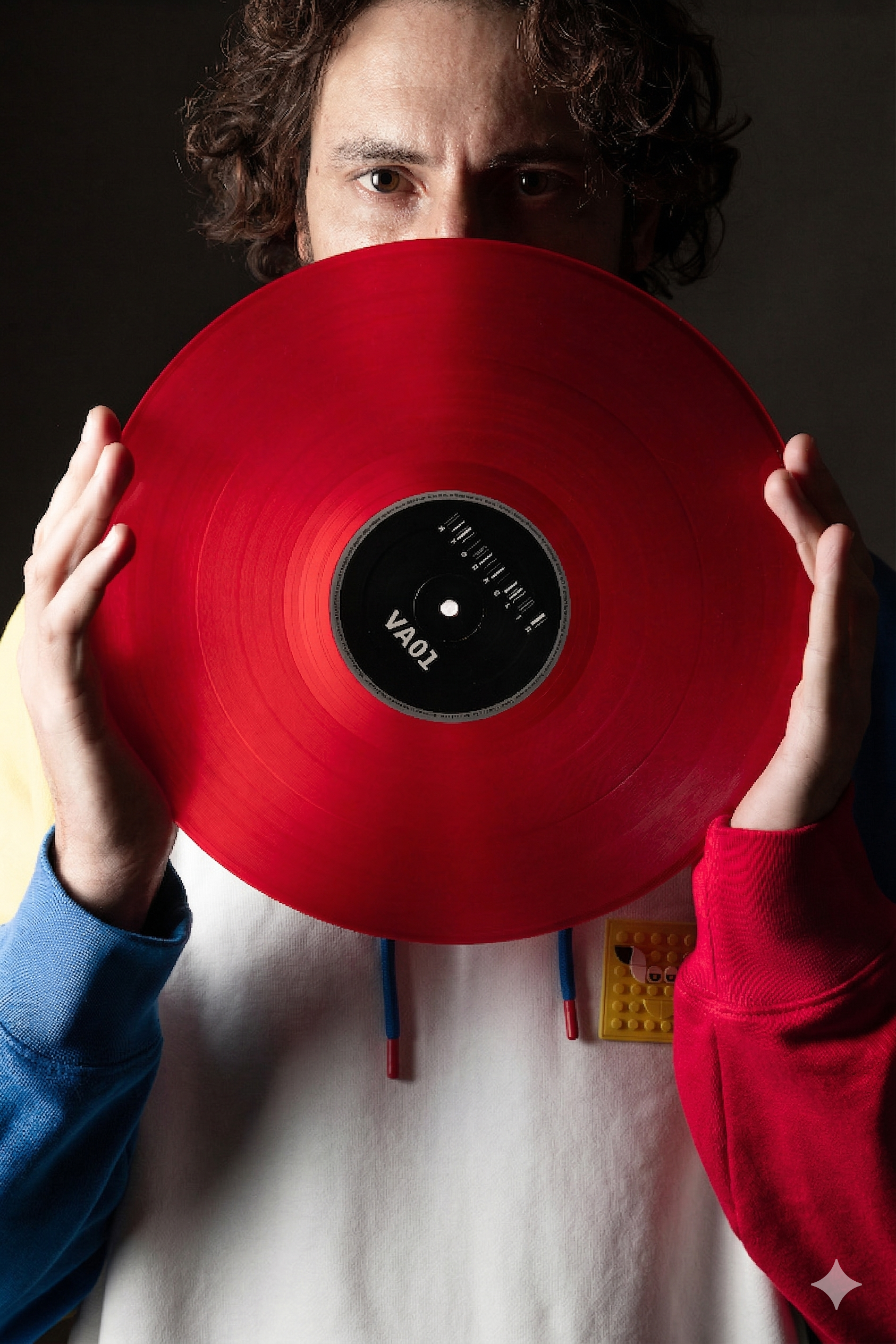 Cabra holding red vinyl